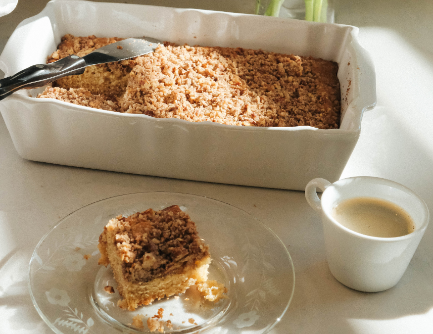 slice of coffee cake and tray of coffee cake